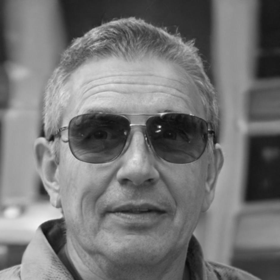 Senior financial analyst and instructor reviewing investment portfolio analysis